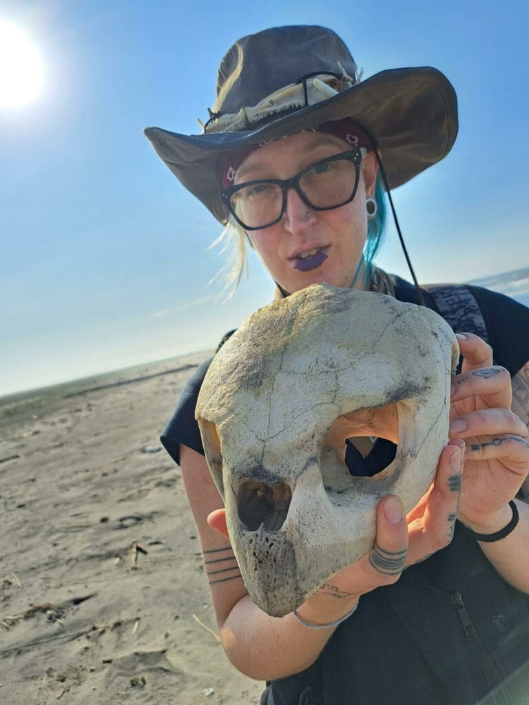 Musician Phoenix Roebuck holds an animal skull