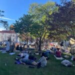 Group enjoying gong bath outdoors at O+ Festival